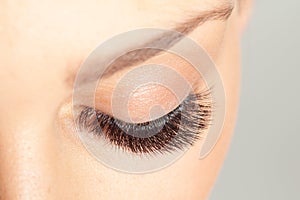 Close up shot of closed eye with long eyelashes. Eyelash Extension. Beautiful Lashes macro