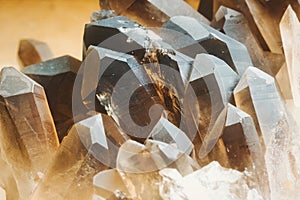 A close-up shot of a cluster of smokey quartz stones