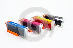Close-up shot of a CMYK ink cartridges for a color printer isolated on a white background with clipping path.