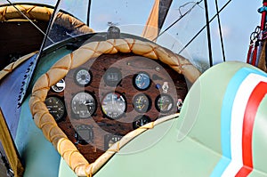 Close-up shot of a cockpit detail and flight control panel of a vintage plane
