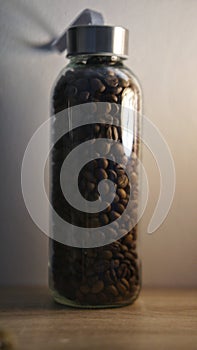 Close up shot of coffee beans inside a bottle