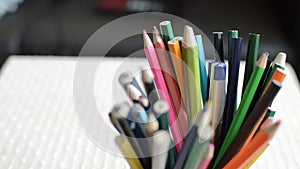 shot of colored pencils standing in a jar