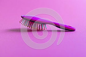 Close up shot of a colorful hairbrush. Concept