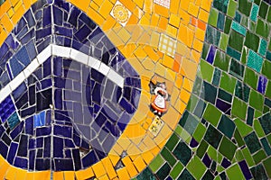 Close-up shot of the colorful tiled Brazil flag at the Escadaria Selaron in Rio de Janeiro, Brazil photo