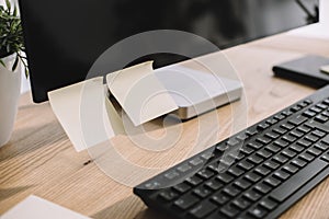 close-up shot of computer screen with blank stickers and keyboard