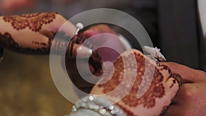 Close up shot of couples. Couple standing together dressed in traditional Indian clothes, hindu wedding.