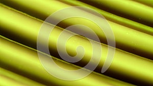 Close up shot of cream background. Face or body smooth yellow cream fluid texture with flat lines rotating. Slow motion.