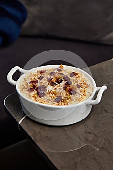 Close up shot of a creamy dessert in a ceramic pot