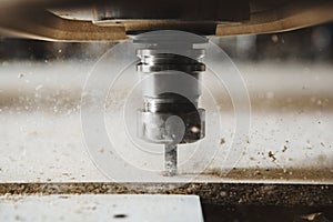 Close-up shot of cutting wood with a cnc milling machines.