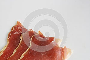 Close up shot of delicious slices of serrano ham