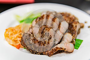 Close up shot of a dish of grilled mountain swin meat