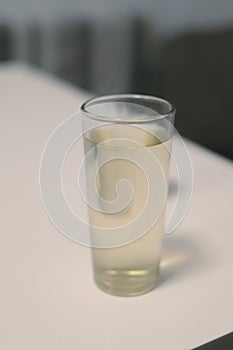 close up shot of a drink in a glass on the table
