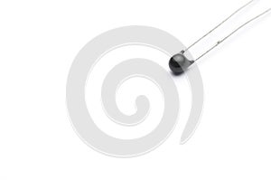 Close-up shot of an electronic thermistor isolated on white background photo