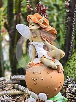 Close up shot of elf statue in the forest. Fairy,