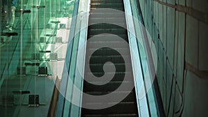 Close-up shot of empty moving staircase running up and down. Modern escalator