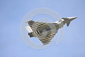 Eurofighter Typhoon in flight against a clear sky photo