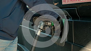 Close up shot of Filling up a truck with fuel at truck gas station,