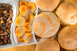 Close-up shot of fresh homemade muffins. Sweet spices, raisins, dried apricots. Selective focus, shallow depth of field