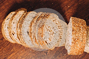 Close-up shot of a freshly sliced loaf of bread on a cutting board