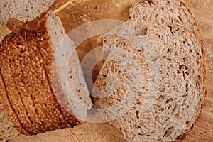 Close-up shot of a freshly sliced loaf of bread on a cutting board