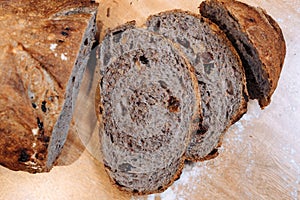 Close-up shot of a freshly sliced loaf of bread on a cutting board