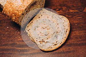 Close-up shot of a freshly sliced loaf of bread on a cutting board