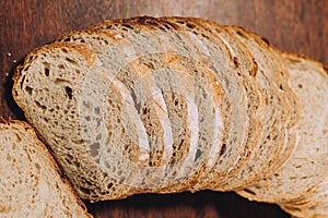 Close-up shot of a freshly sliced loaf of bread on a cutting board