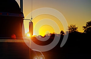 Close up shot the front of a truck against sunset