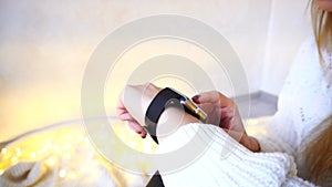 Close-up shot of gadget on female hand that tests smart watch in