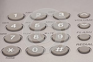 Close up shot of grey phone keypad