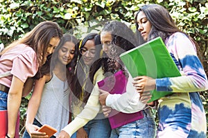 Close-up shot of a group of Latina teenage students taking a selfie with a cell phone