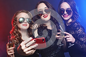 Close-up shot of group of laughing girls having party, take self