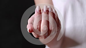 Close-up shot of a hand holding color pills on background