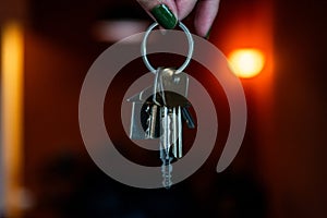 Close-up shot of hands holding keys.