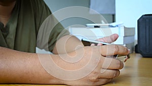 Close up shot hands of man using smart phone and holding credit card metaphor internet shopping mobile application and e business