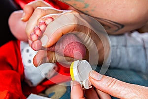 Obstetrician checks newborn infant photo