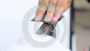 Close up shot hands of technician using sandpaper to to polishing the black stainless steel preparing for color paint with ambient