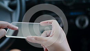 Close up shot hands of woman using blank clear glass same like smart phone in the car for futuristic cyber technology transport co
