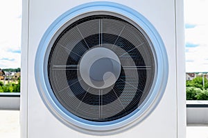 Close-up shot of a heat pump fan for solar systems on the roof
