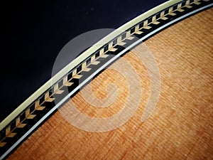 Close up shot of Herringbone Purfling detal on guittar