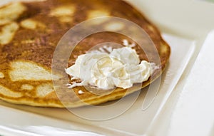 Close up shot of a home made pancake on the plate. Food