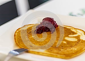 Close up shot of a home made pancake on the plate. Food