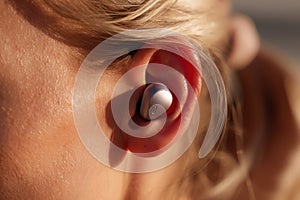 Human Ear with Wireless Earbud Technology Personal Style
