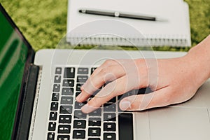 Close-Up Shot of Human Hands Placed Over Laptop