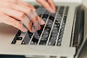 Close-Up Shot of Human Hands Placed Over Laptop