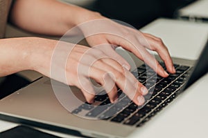 Close-Up Shot of Human Hands Placed Over Laptop