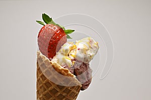 Close-up shot of ice cream cone with strawberry