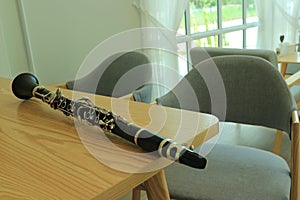 Close-up shot of a jazz clarinet instrument on a wooden table