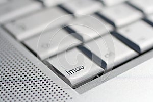 Close up shot of a laptop keyboard with a `lmao` key in focus photo