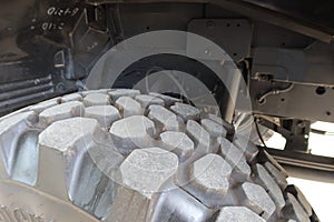 Close-up shot of large tires of a truck undercarriage